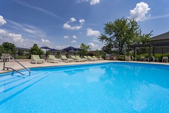 Resort-style sparkling pool with sundeck